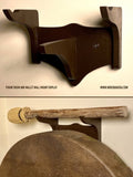 A wooden wall mount designed for displaying a frame drum with a mallet hanging above it. Shamanic ceremony hand drums
